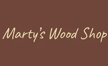 Marty's Wood Shop Sign on Brown Background