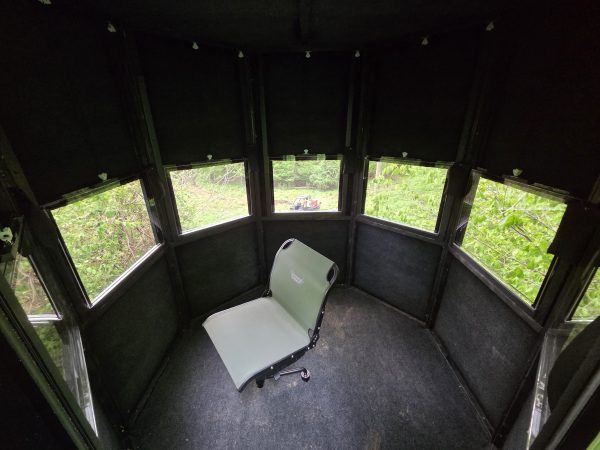 Interior of a Surround View Hunting Blind with a single chair