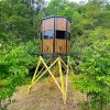 Elevated Surround View Hunting Blind in Green Forest Setting