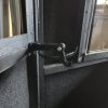 Adjustable Bow Hanger Inside Hunting Blind with Black Walls