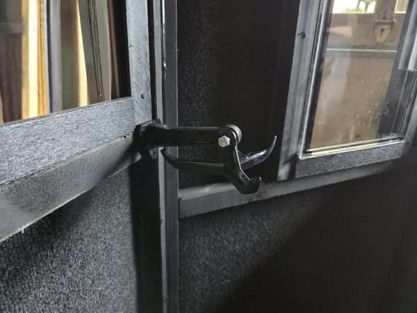 Adjustable Bow Hanger Inside Hunting Blind with Black Walls